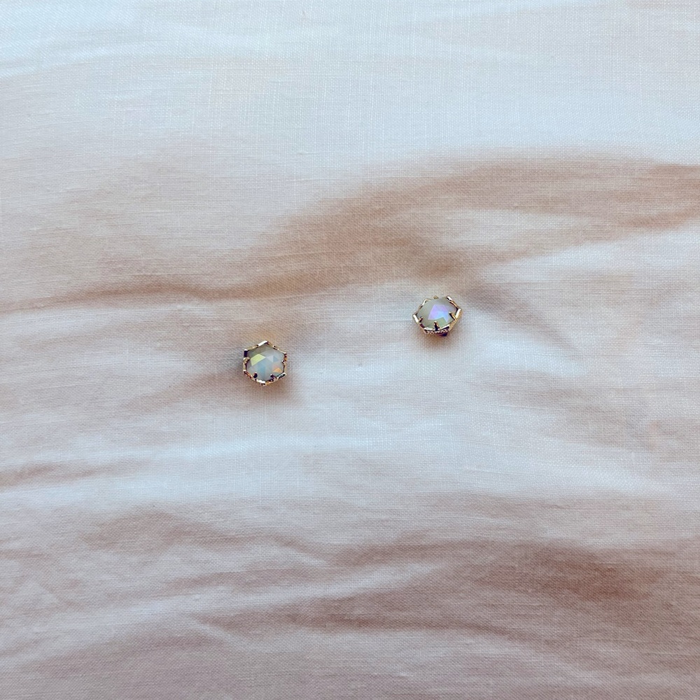 Kendra Scott gold studs in iridescent abalone